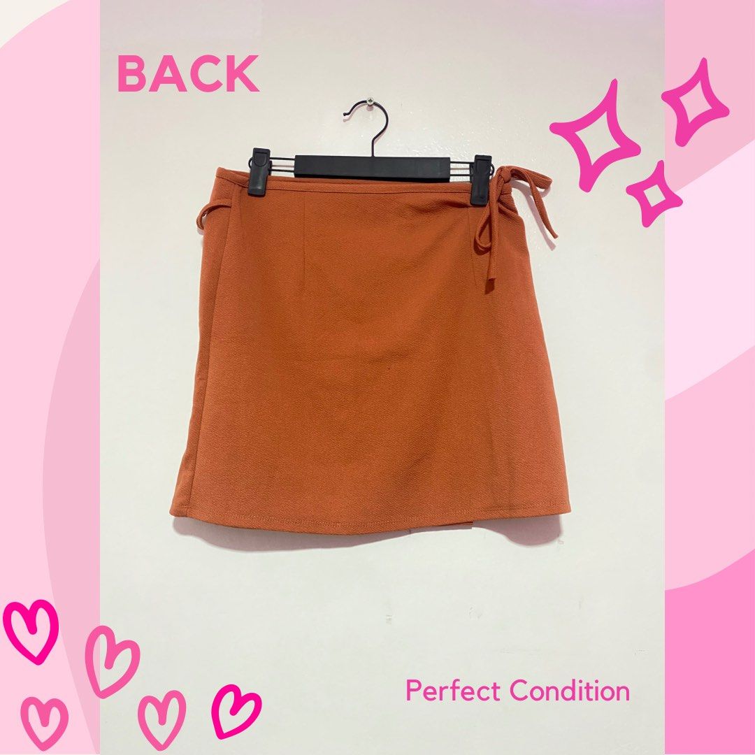 Orange Wrap Around Skirt (Category: Skirts) located in Quezon City. Submitted by cluelessclutter (Listing ID 1271771212, Image 2). Description: Burnt Orange Wrap-around skirt ✨ ⭐️ PERFECT CONDITION Perfect for kikay OOTDs and preppy vibes! 💖 1. Please manage your expectations. These are PERSONAL preloved items (not from bales) so there might be MINIMAL signs of usage and/or stains. ✨ 2. Actual item color may be affected by the lighting and photo