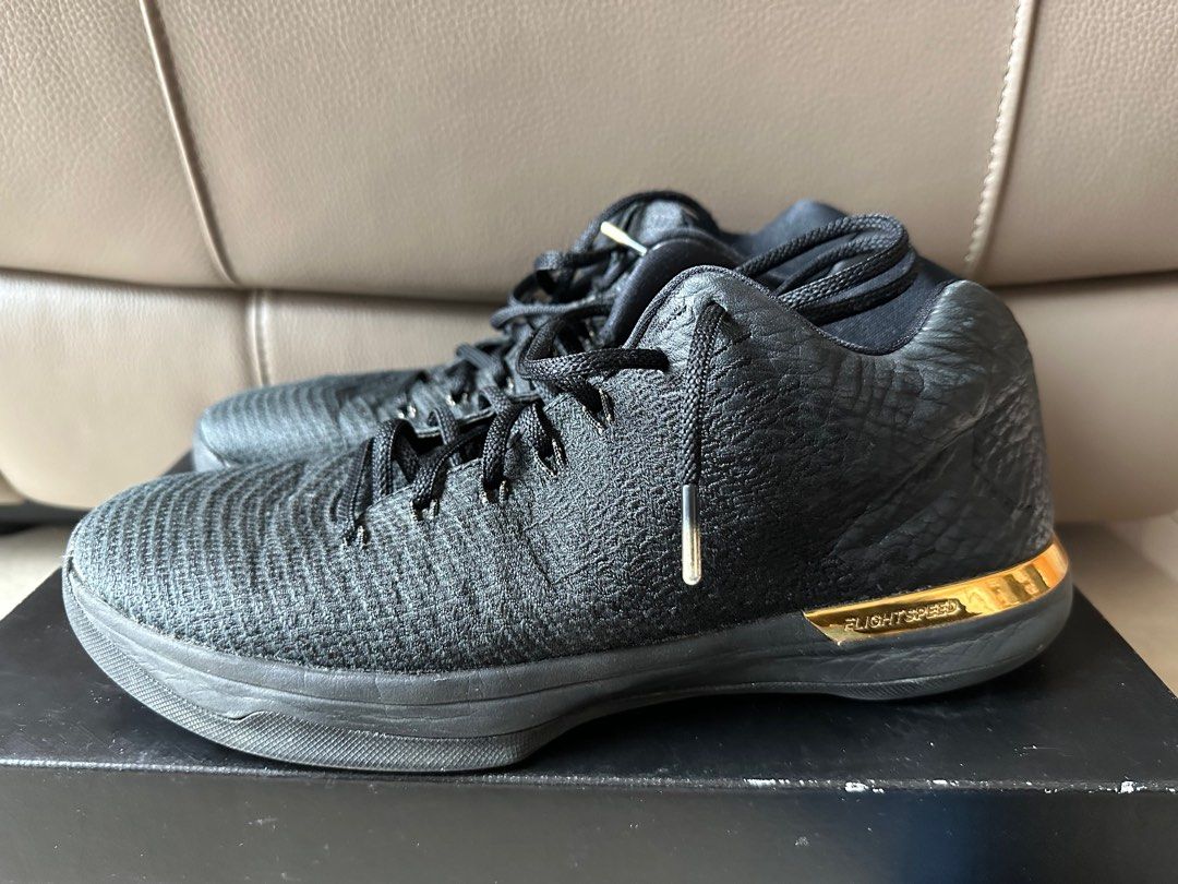 Jordan 31 low hotsell black and gold