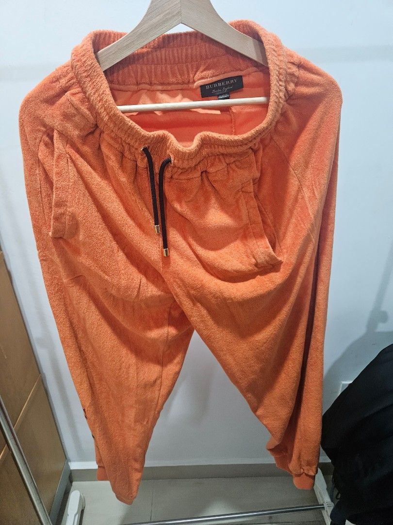 Orange burberry mobile sweatpants