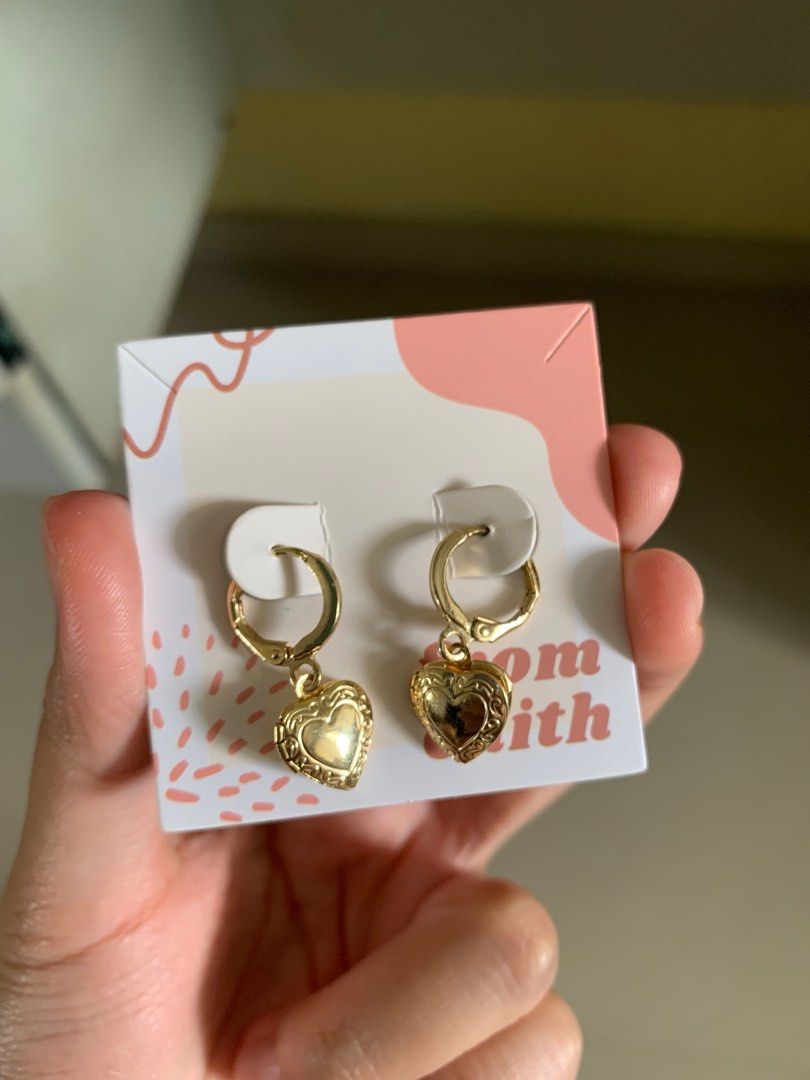 Gold locket and earrings top