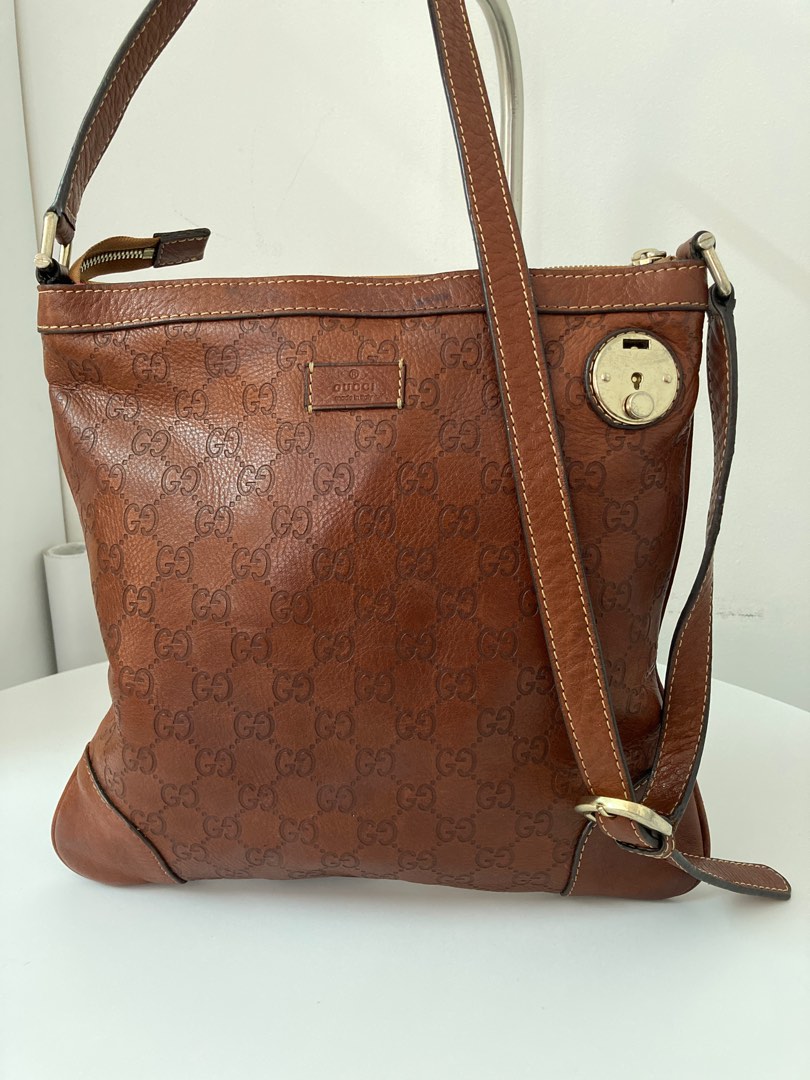Gucci sling new arrivals bag brown