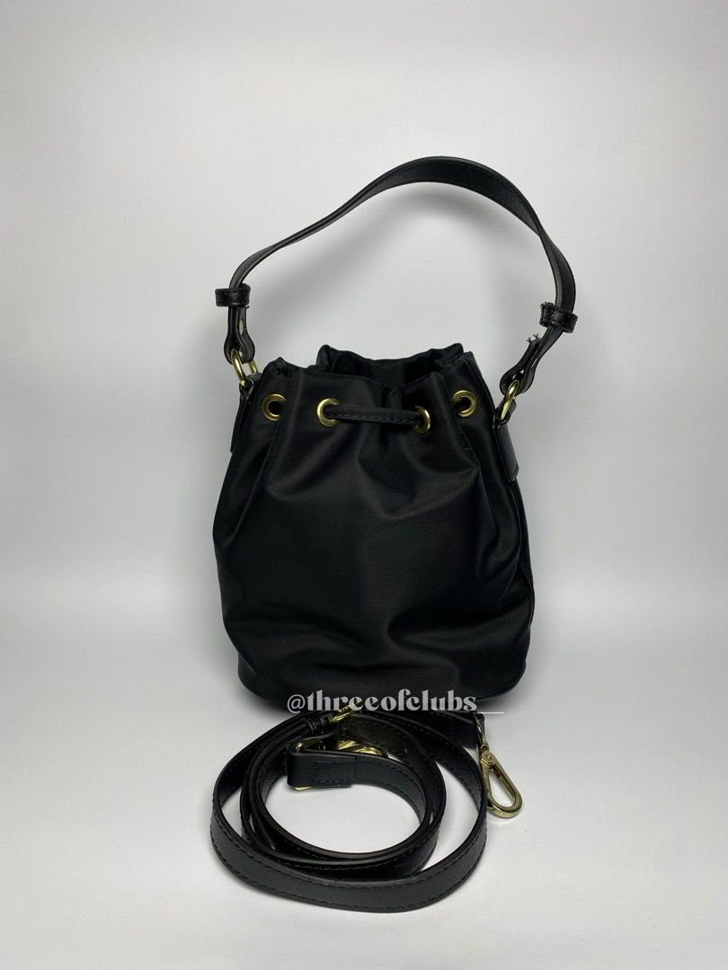Prada Black Nylon Bucket Two Way (Category: Luxury Bags & Wallets) located in Quezon City. Submitted by threeofclubs__ (Listing ID 1272213882, Image 3). Description: Excellent condition Not guaranteed (N.G.A) Clean nylon body Clean interior with tag No discoloration, no yellowish No stains No rubbings No cracking Very nice hardwares Handle is adjustable and attachable Minimal signs of usage zoom photos always Approximate dimensions: 7.0” L x 8.0”
