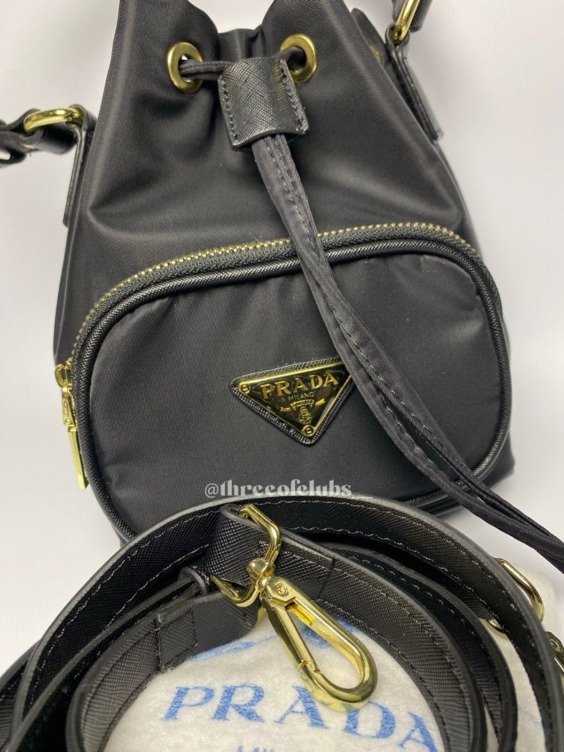 Prada Black Nylon Bucket Two Way (Category: Luxury Bags & Wallets) located in Quezon City. Submitted by threeofclubs__ (Listing ID 1272213882, Image 2). Description: Excellent condition Not guaranteed (N.G.A) Clean nylon body Clean interior with tag No discoloration, no yellowish No stains No rubbings No cracking Very nice hardwares Handle is adjustable and attachable Minimal signs of usage zoom photos always Approximate dimensions: 7.0” L x 8.0”