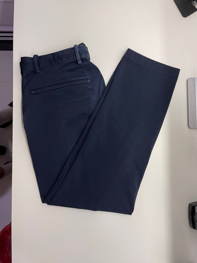 Uniqlo men smart ankle pant (ultra stretch) navy blue, Women's Fashion,  Bottoms, Other Bottoms on Carousell