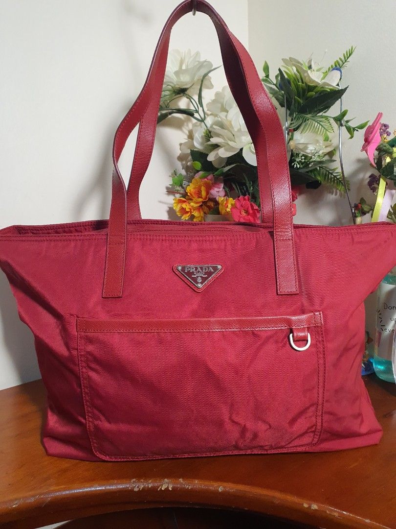 Authentic💯 Prada Red Nylon Tote Bag (Category: Luxury Bags & Wallets) located in Tagum. Submitted by maryjanepradalux (Listing ID 1272442969, Image 1). Description: *No inclusion *No Flaws *No Issue *Slightly used *bought from singapore *Money Back Guarantee if proven fake *Pm for more details.