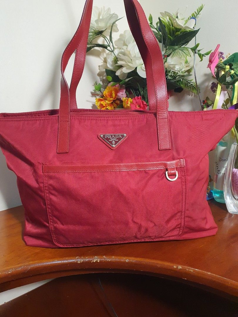 Authentic💯 Prada Red Nylon Tote Bag (Category: Luxury Bags & Wallets) located in Tagum. Submitted by maryjanepradalux (Listing ID 1272442969, Image 2). Description: *No inclusion *No Flaws *No Issue *Slightly used *bought from singapore *Money Back Guarantee if proven fake *Pm for more details.