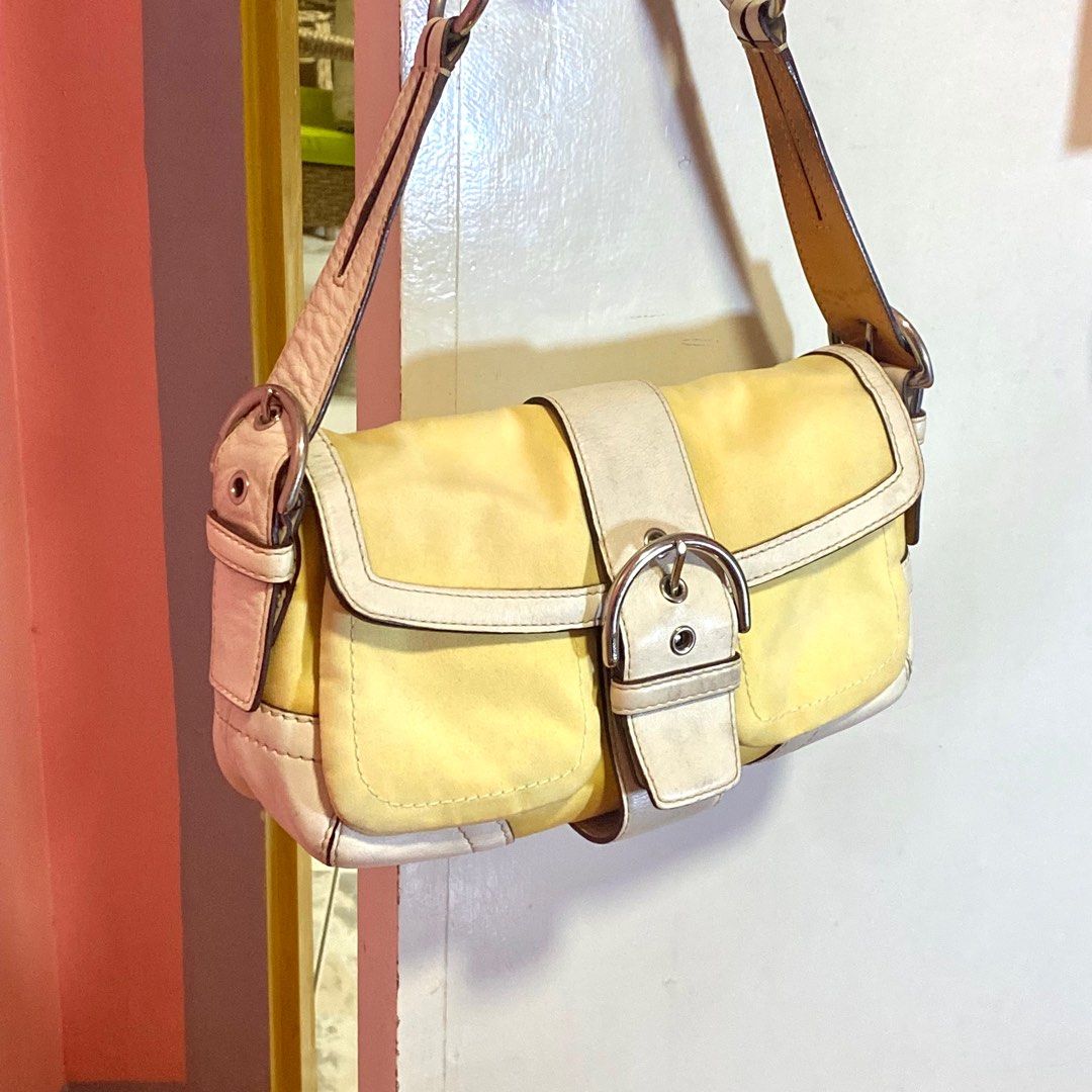 Coach Soho Buckle Bag (Category: Luxury Bags & Wallets) located in Batangas. Submitted by avery.declutter (Listing ID 1272364172, Image 2). Description: A coach soho twill bag in a rare color! 💛🪞🫶🏻 CODE: M05S 1879 • Guaranteed authentic/original (money back if proven fake) • Hardware: Silver Tone • RANK AB: good condition • Needs cleaning/bag spa c • Leather is intact (no bakbak).