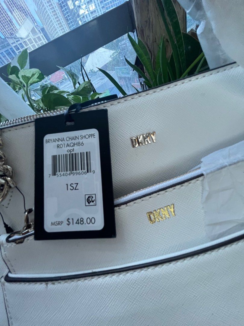 DKNY Bryanna Shoulder Bag with Pouch white (Category: Luxury Bags & Wallets) located in Quezon City. Submitted by vianca13 (Listing ID 1272414455, Image 3). Description: DKNY signature Logo to the front. 1 Outer Back Slip Pocket. Inside: 1 Middle Zipper compartment With Two Slip Pockets One Zipper Pocket Shoulder Strap Bag Approximate Bag Size: 13”W X 10’’ H X 5’’ D.