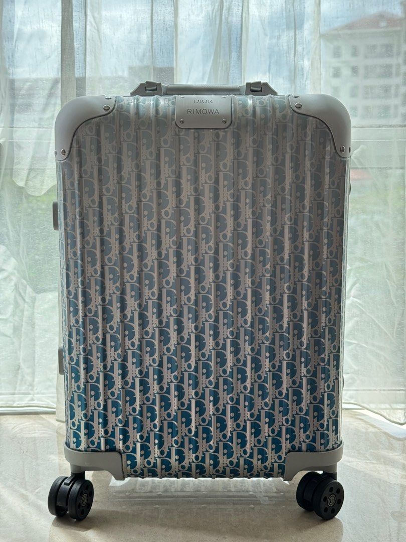 Rimowa discount dior suitcase