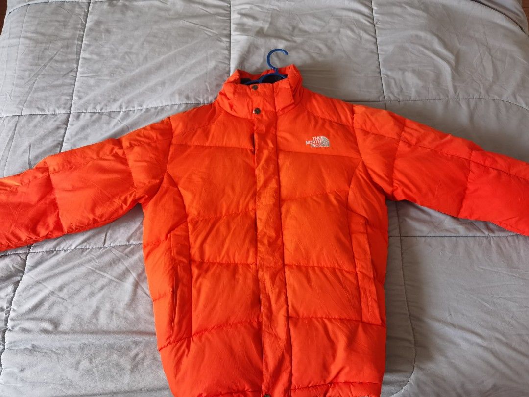 Orange north face puffer on sale