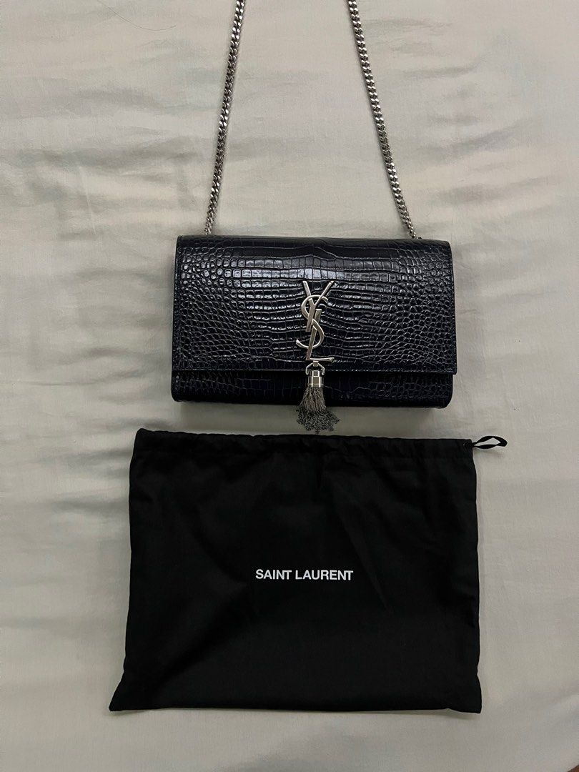 YSL Kate Medium Croc Embossed with Tassel (Category: Luxury Bags & Wallets) located in Makati City. Submitted by tidying_up_ (Listing ID 1272369663, Image 2). Description: Brand new Color: Silver chain and tassel, midnight blue Comes with original dust bag and YSL paper bag Bought from Europe DM for more pics. Slightly negotiable RFS: decluttering, funds for new bag.
