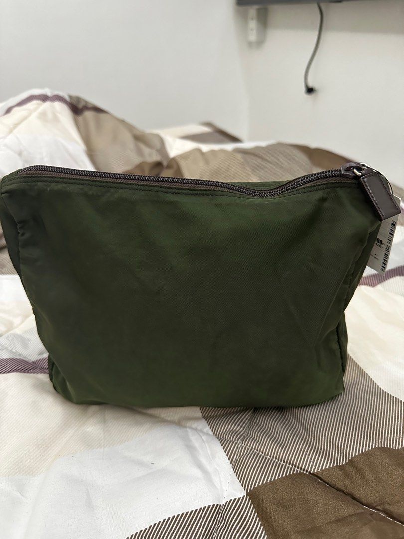 Authentic PRADA Nylon Pouch (Category: Luxury Bags & Wallets) located in Binan City. Submitted by resasanmig (Listing ID 1272532026, Image 3). Description: Authentic Prada Nylon pouch bought in Japan No damages or any issues. Fits Ipad Rfs : hindi ginagamit .