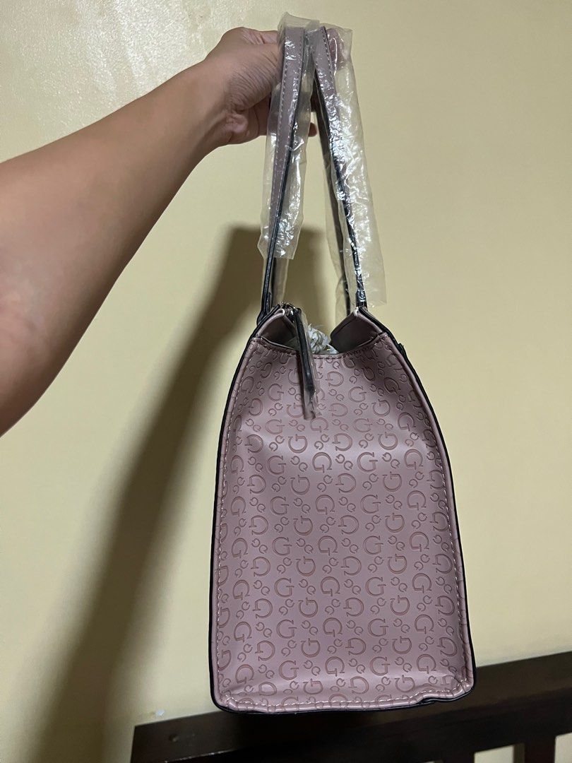 Guess Booker Satchel Bag (Category: Shoulder Bags) located in Cainta. Submitted by stuff01 (Listing ID 1272539676, Image 3). Description: 💯Authentic Bought in Malaysia Brand New Never used, just stored Flaw: Part of one side has a little chip off but unnoticeable (see last photo).