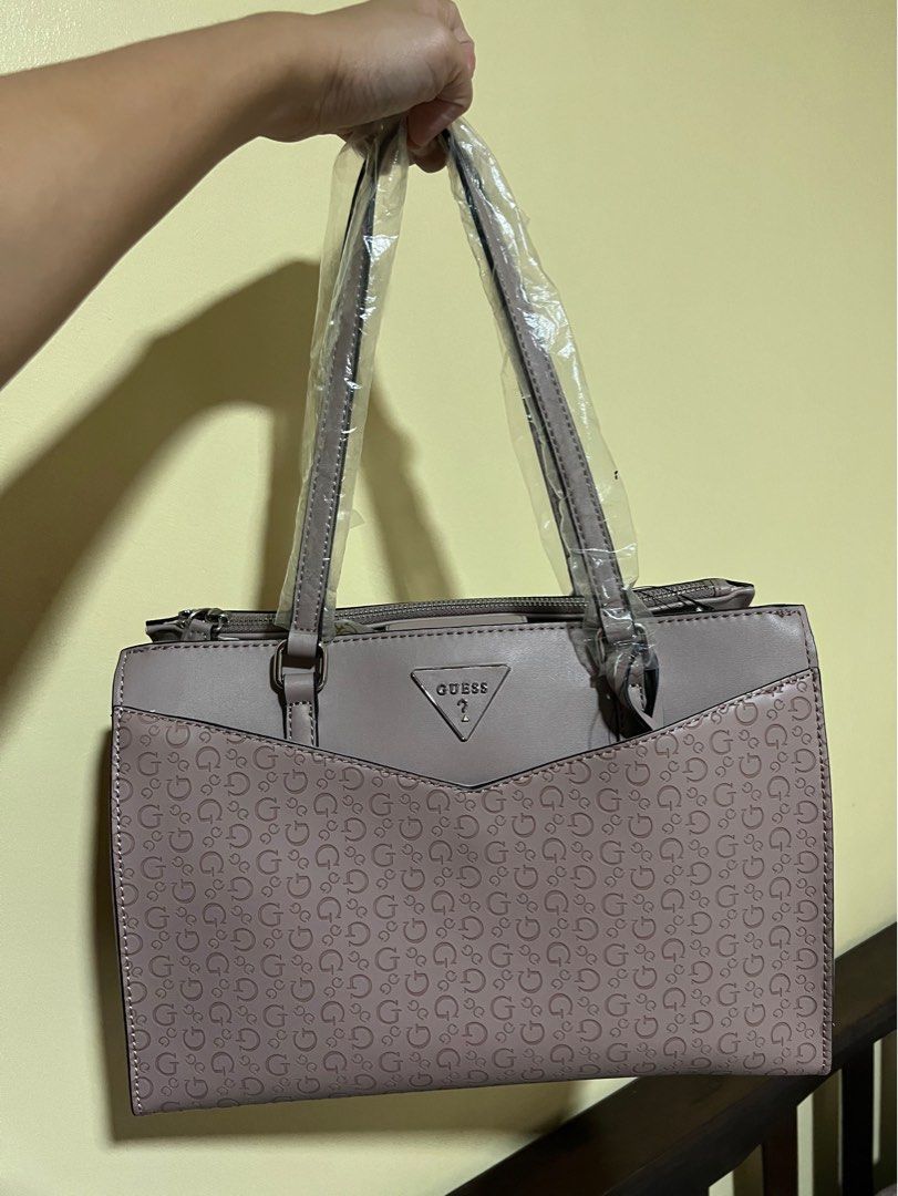 Guess Booker Satchel Bag (Category: Shoulder Bags) located in Cainta. Submitted by stuff01 (Listing ID 1272539676, Image 1). Description: 💯Authentic Bought in Malaysia Brand New Never used, just stored Flaw: Part of one side has a little chip off but unnoticeable (see last photo).