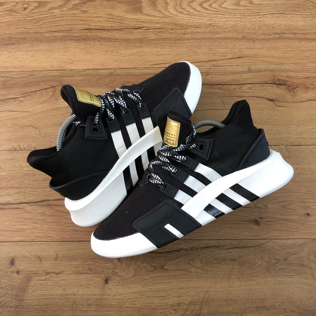 Black and hotsell gold adidas eqt