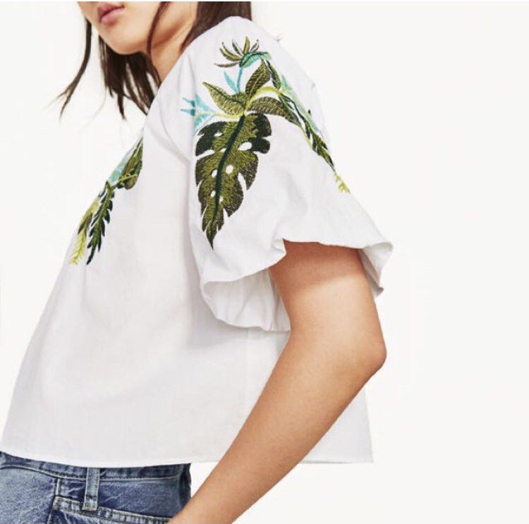 Authentic Zara Embroidered Blouse (Category: Blouses) located in Quezon City. Submitted by onyx72 (Listing ID 1269071421, Image 2). Description: Authentic Zara Embroidered Blouse Slightly Cropped With neckline Puffy short sleeves Embroidered leaves detailing on the front & sleeves Small on tag Best fits xtra small to small Signs of usage First 3 photos not mine😬 .
