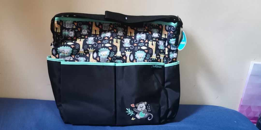 Babyboom Diaper Bag (Category: Diaper Bags & Wetbags) located in Los Banos. Submitted by louissepea (Listing ID 1268927431, Image 3). Description: BRAND NEW US BOUGHT SF C/O BUYER The Baby Boom Monkey tote diaper bag is the ultimate bag for all of your baby's essentials! Hold all of your baby care needs and personal belongings in the spacious interior with 5 storage pockets, including five exterior pockets to keep you organized, and side pockets 