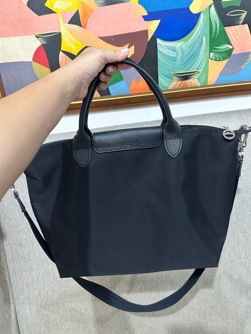 🔥💯LONGCHAMP🔥 Neo Medium - Black (preloved) (Category: Cross-body Bags) located in Mandaluyong City. Submitted by StuffofMyDreamsph (Listing ID 1268923843, Image 2). Description: LONGCHAMP NEO SLING BAG (Black) 🤝 Preloved but well LOVED ❤️ 🤝 Usual sign of usage (folds/ konteng rubs) 🤝 This travel bag with a detachable shoulder strap 🤝 Size:: 10.8x12.5x7inches 🤝 Soft and lightweight 🤝Minimal & unseen flaws must be considered.. 🤝Color rate
