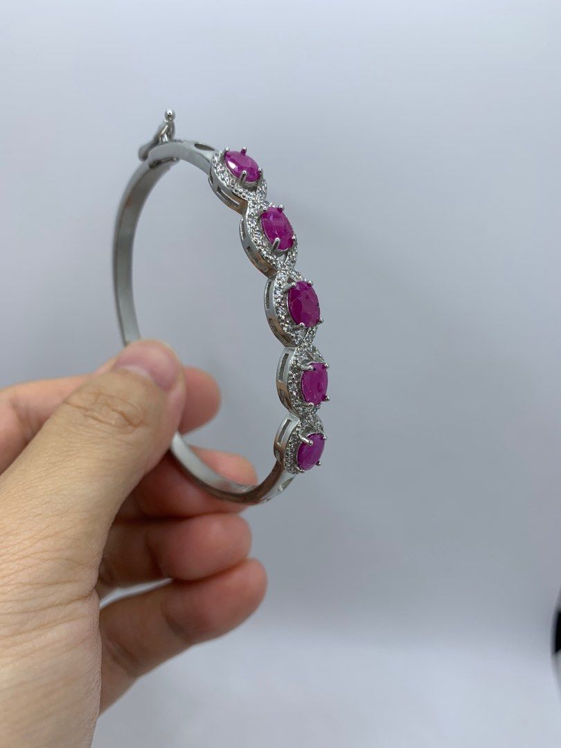 Pink Ruby bracelet/bangle (Category: Bracelets) located in Singapore. Submitted by llovecoffee (Listing ID 1265973321, Image 1). Description: Brand New Natural precious stone Ruby. Setting on 925 Silver Inner diameter pls refer to pics Open buckle to wear on/remove Welcome to view before purchase Self collect or mailing .