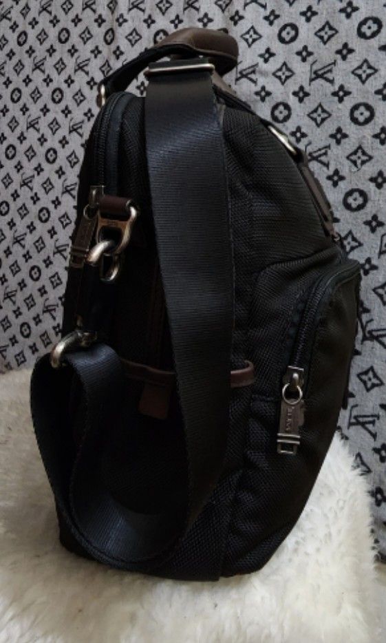 Tumi canvas messenger bag top