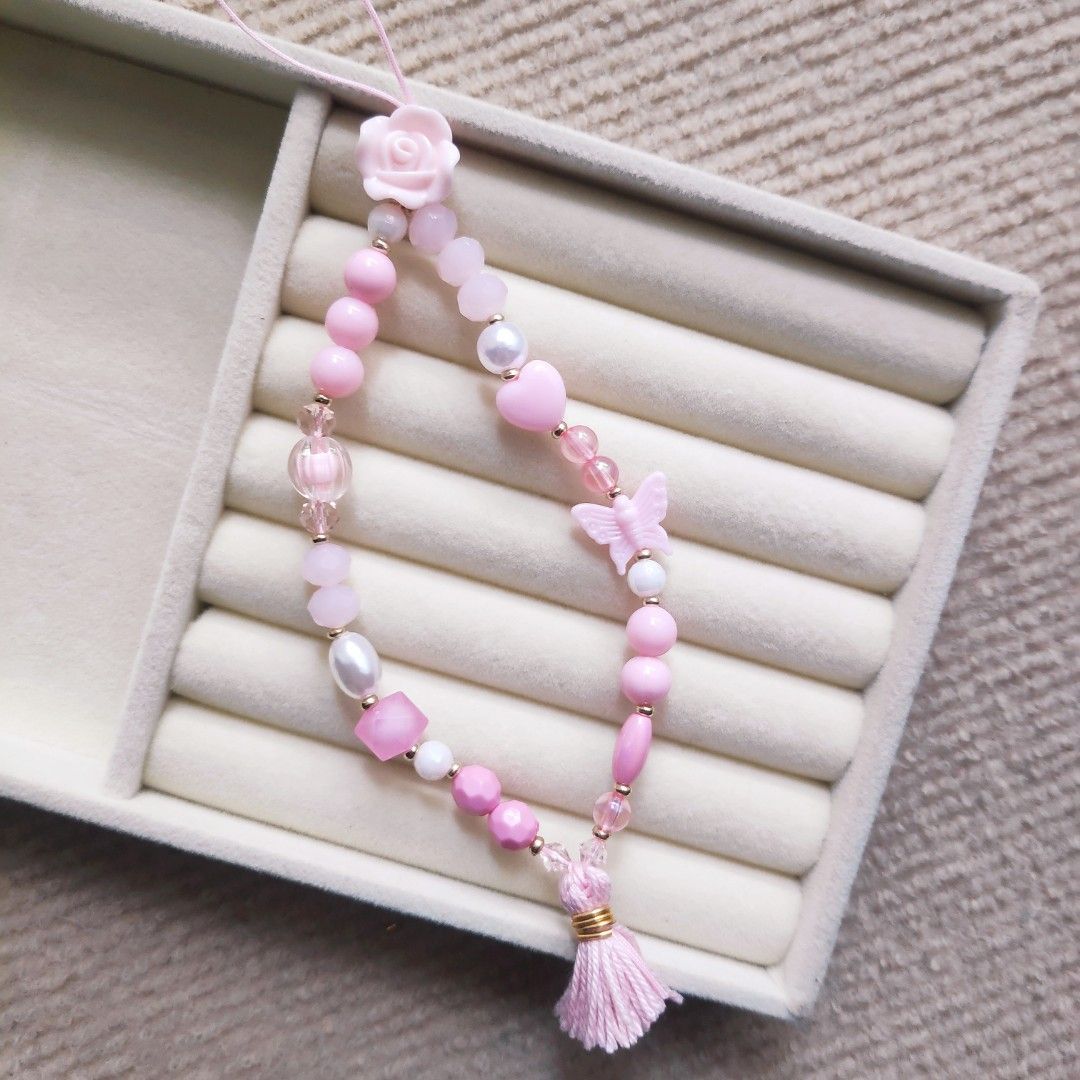 Cute Phone Charms 4 colors (Category: Mounts & Holders) located in Manila. Submitted by thestylevixen (Listing ID 1272800336, Image 2). Description: - materials: acrylic beads, faux pearls, glass crystals - size: 9.5-10 inches in diameter (fits wrist) - available in purple, white, pink, light blue. other colors may be available upon request. #phonecharms #pastel #phonestrap #beadlanyard #purple #phonelanyard #accessories.