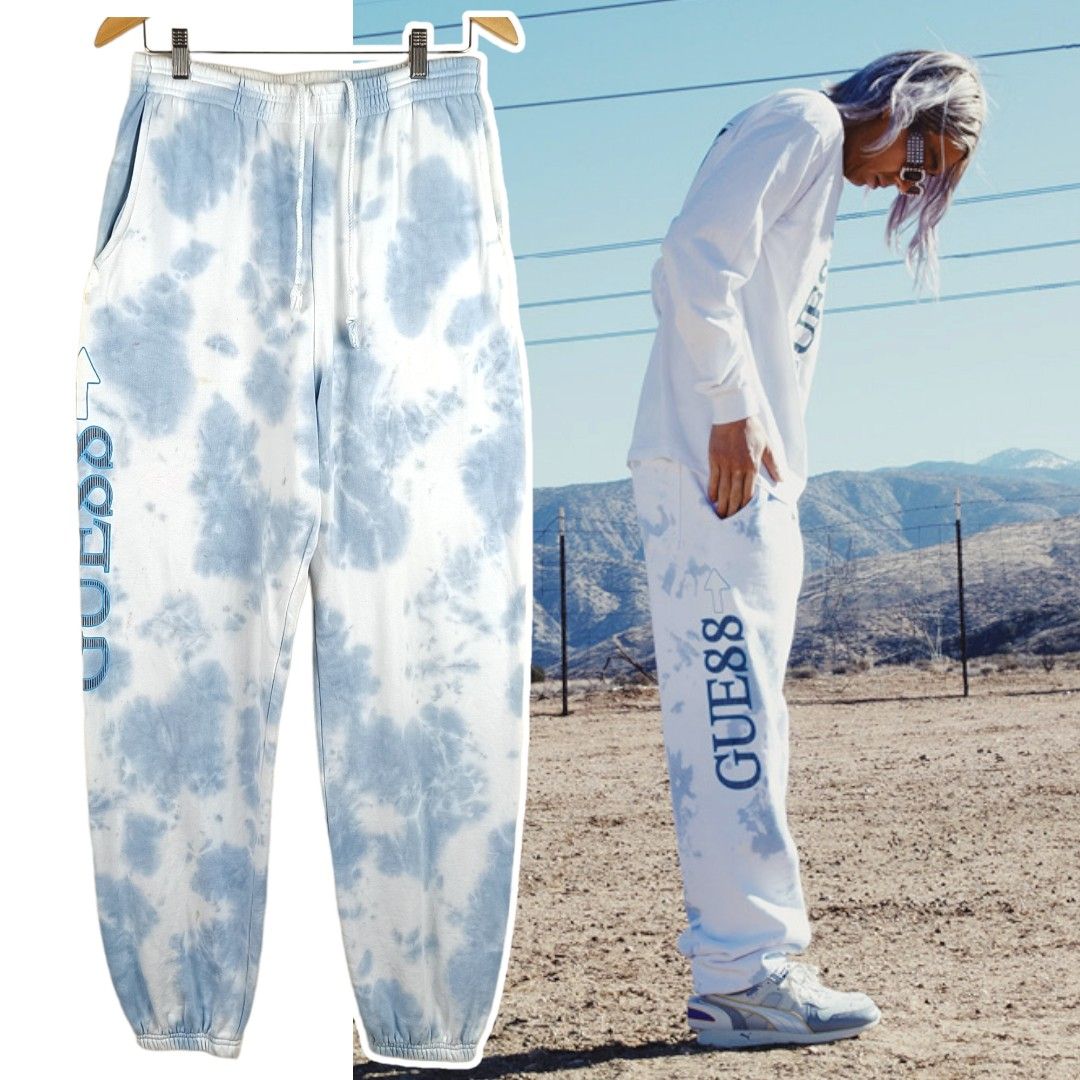 GUESS x 88RISING Tie dye light blue sweatpants Fesyen Pria Pakaian Bawahan di Carousell
