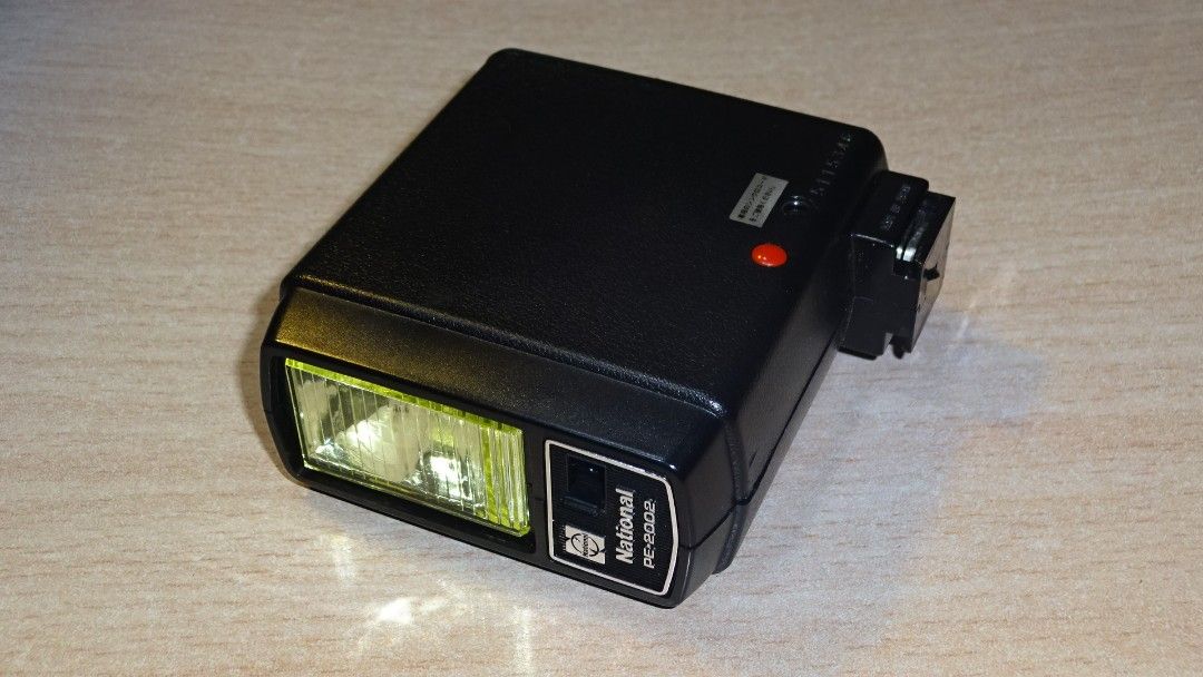 National PE-2002 film camera flash (Category: Flashes) located in Paranaque City. Submitted by kutoi.ancheta (Listing ID 1272828655, Image 3). Description: National PE-2002 film camera flash ₱900 ✅ hot shoe mount ✅ uses 4x AA batteries! (excluded) ✅ 6/10 cosmetics with signs of use! condition: seems to be functioning! ☝️trigger voltage and compatibility your responsibility! As is only! Defects included! no warranties! pm for inquiries. #nationalc