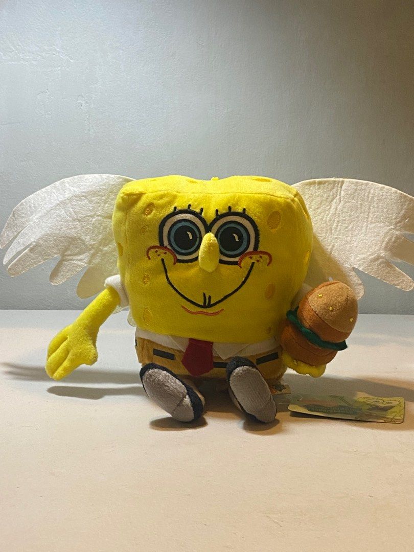 Spongebob with angel wings holding a krabby patty plush Hobbies