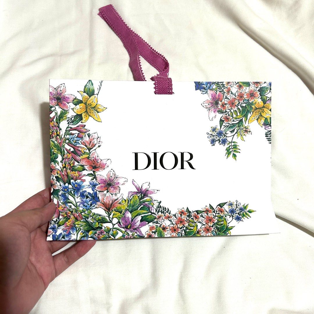 Dior Small Paper Bag with ribbon (Category: Luxury Bags & Wallets) located in Caloocan City. Submitted by pasabuybytinedahan (Listing ID 1272947277, Image 1). Description: with dirt on one side, see second picture.