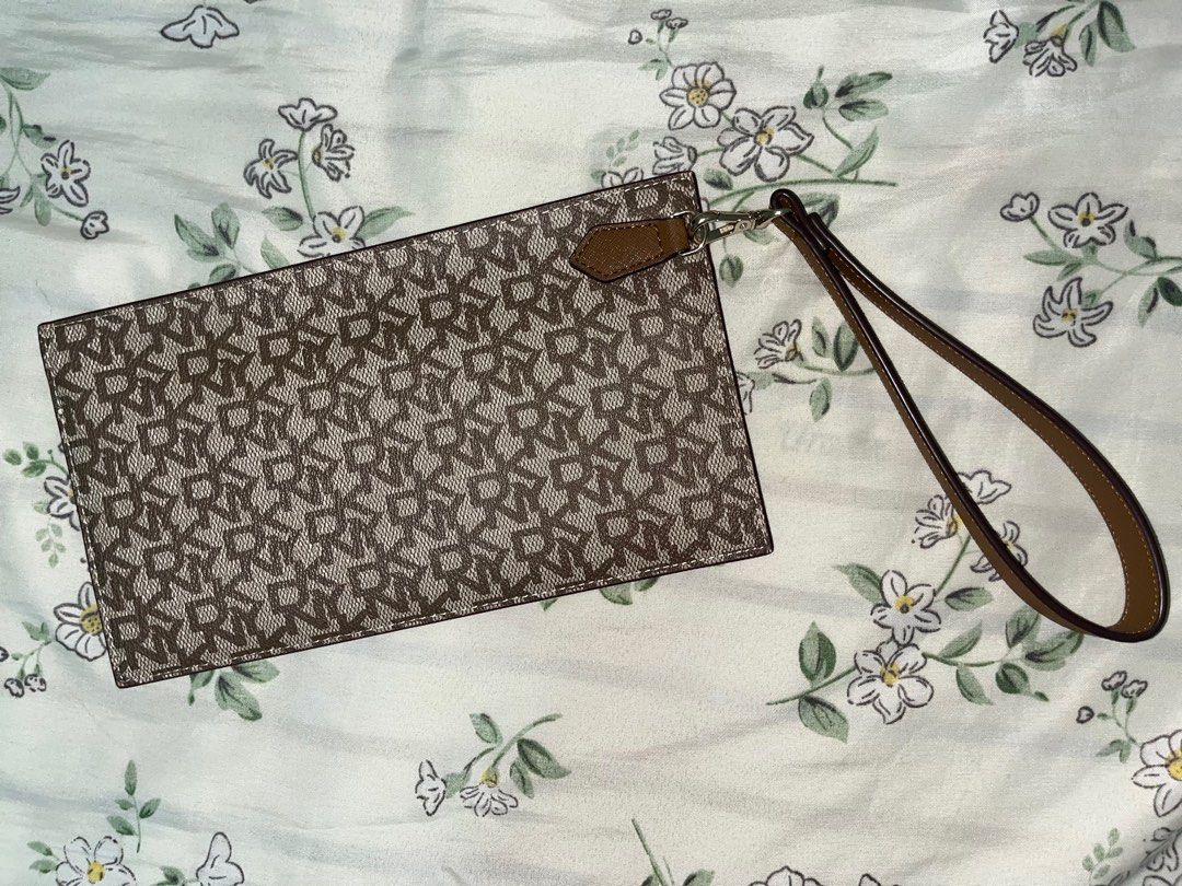 DKNY Monogram Wristlet Pouch Wallet (Category: Luxury Bags & Wallets) located in Candelaria. Submitted by mnloangel (Listing ID 1272983609, Image 3). Description: Guaranteed Authentic. Can fit phone and some cash. In perfect condition. Perfect gift this Christmas! DM for inquiries. .