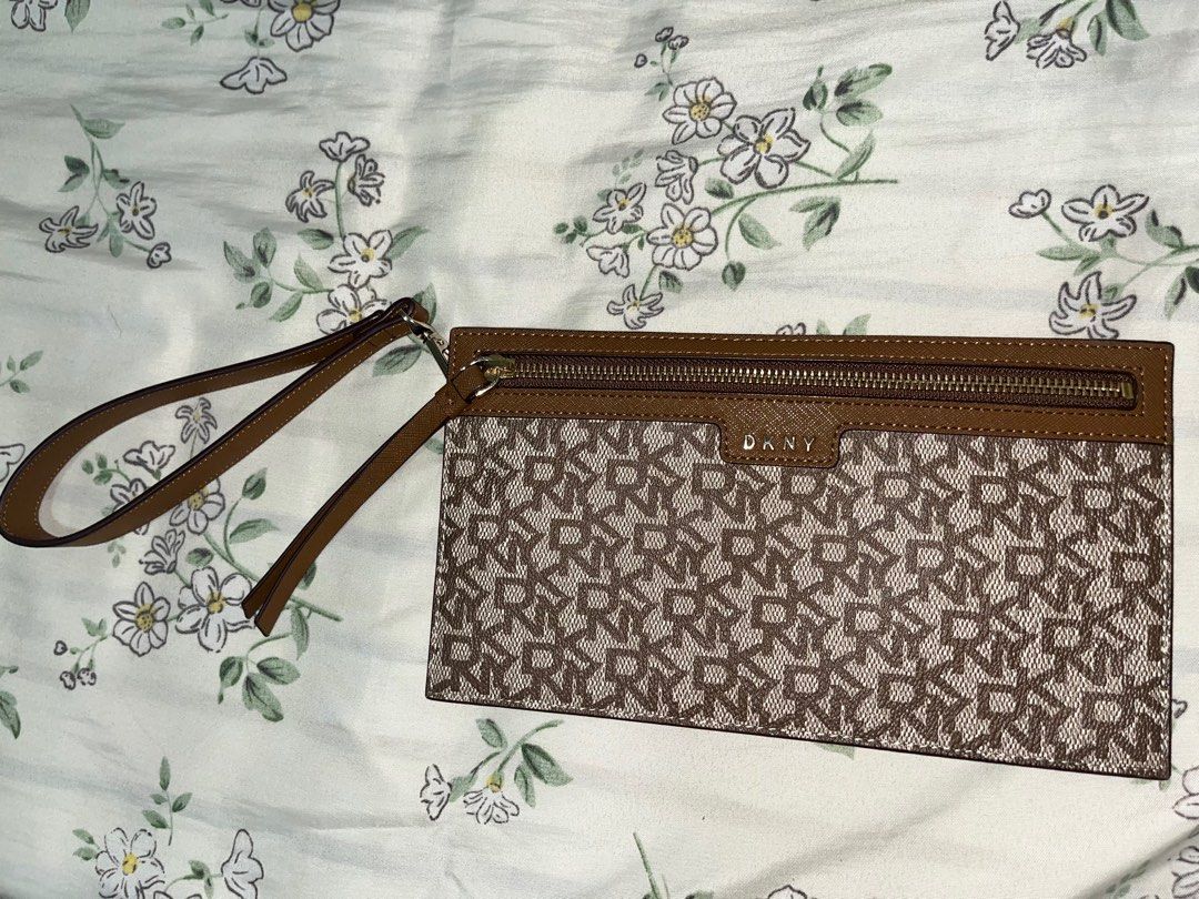 DKNY Monogram Wristlet Pouch Wallet (Category: Luxury Bags & Wallets) located in Candelaria. Submitted by mnloangel (Listing ID 1272983609, Image 2). Description: Guaranteed Authentic. Can fit phone and some cash. In perfect condition. Perfect gift this Christmas! DM for inquiries. .