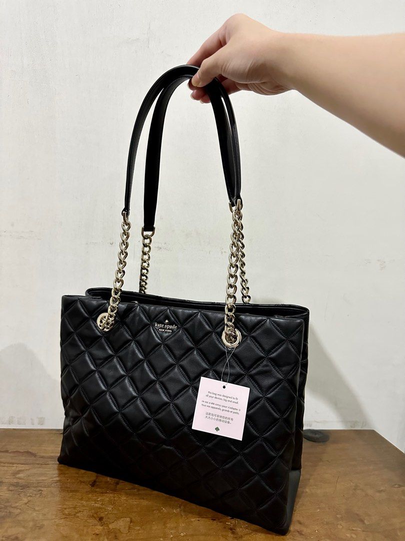 Kate Spade Natalia Large Tote Bag (Category: Luxury Bags & Wallets) located in Cavite. Submitted by stylisee.ph (Listing ID 1208198024, Image 2). Description: Brand New with Tag Bought in the US With minor flaws (dented bottom due to shipment) Measurements: - Bag: 9.8''h x 13.6''w x 5.1''d Material: - Black quilted leather with pale gold hardware Inclusions: Bag and care cards only MOP: GCash, Maya, BDO, or BPI (payment first before shipping) Shi