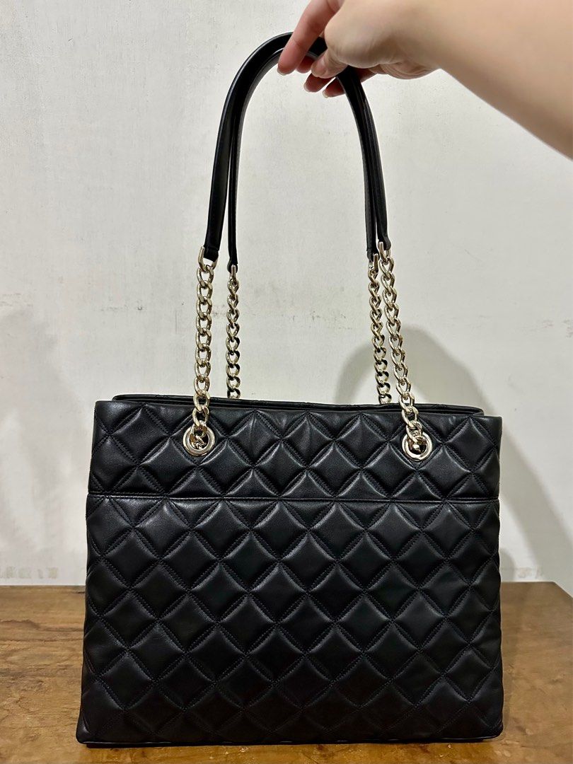 Kate Spade Natalia Large Tote Bag (Category: Luxury Bags & Wallets) located in Cavite. Submitted by stylisee.ph (Listing ID 1208198024, Image 3). Description: Brand New with Tag Bought in the US With minor flaws (dented bottom due to shipment) Measurements: - Bag: 9.8''h x 13.6''w x 5.1''d Material: - Black quilted leather with pale gold hardware Inclusions: Bag and care cards only MOP: GCash, Maya, BDO, or BPI (payment first before shipping) Shi