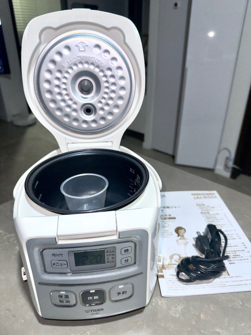 https://media.karousell.com/media/photos/products/2023/12/22/tiger_rice_cooker_jair552_100v_1703249810_2f169824_progressive.jpg