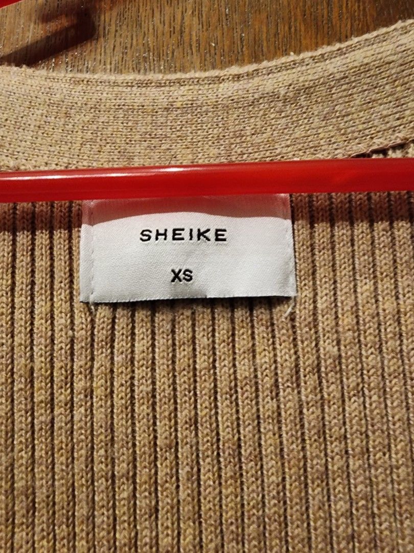 Button thru longline rib cardigan dress (Category: Dresses) located in Paranaque City. Submitted by kachdeclutters (Listing ID 1273615823, Image 3). Description: Brand: Sheike (AU) Size: XS (on tag) but can fit until M Used only once RFS: Decluttering Buyer shoulders shipping fee; Can ship thru LBC/ lalamove/ grab.