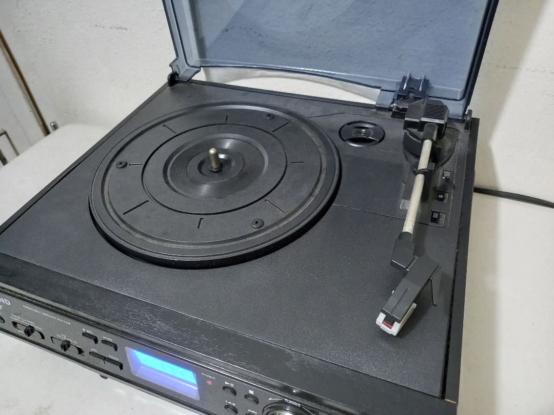 Looptone 3-in-1 Record Player & Radio (Category: Other Audio Equipment) located in Quezon City. Submitted by mb.tan (Listing ID 1273418861, Image 3). Description: - Looptone 3-in-1 Record Player & Radio - Turntable is belt-driven, has a 3 speed function (33rpm, 45rpm, 78rpm), and an auto stop feature. - Side-loading cassette player. - AM/FM radio. - USB and SD card slot. - Comes with dust cover..
