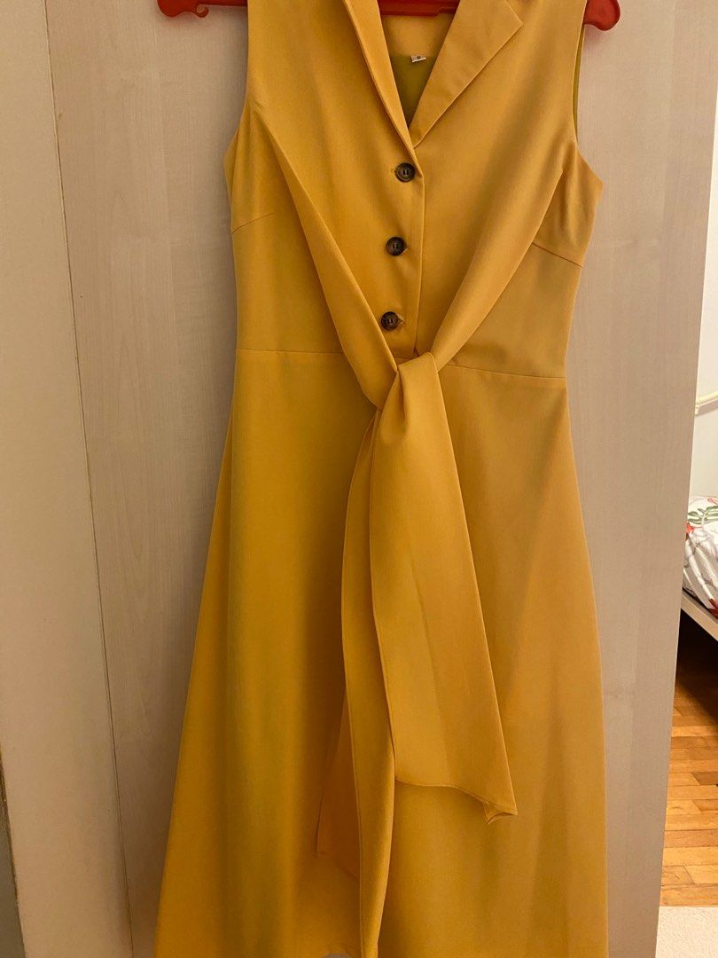 Mustard yellow dress with cute buttons and a front ribbon tie