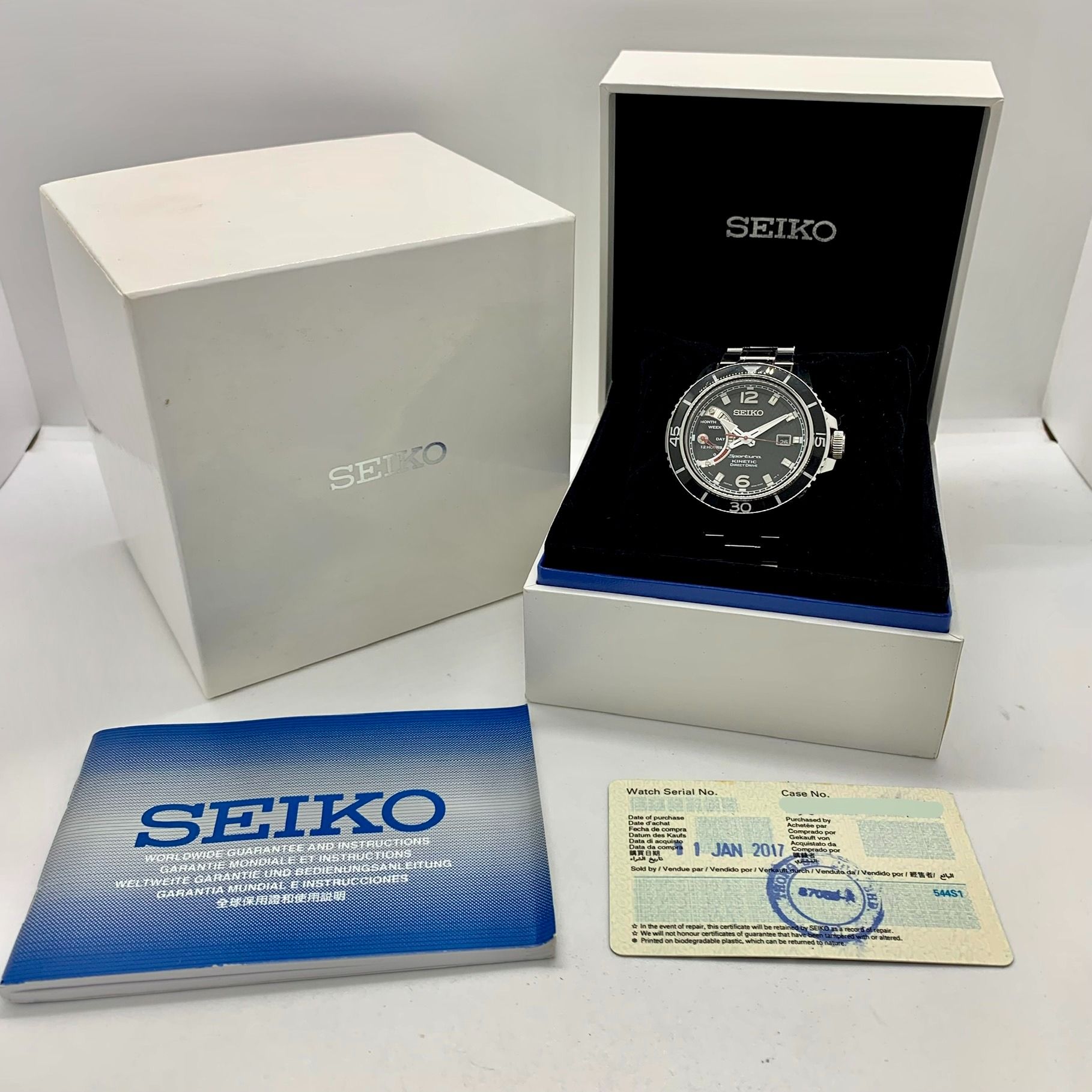 SEIKO 5D22-0AE0 SPORTURA KINETIC DIRECT DRIVE QUARTZ WATCH 237041552 GI (Category: Watches) located in Singapore. Submitted by ertce (Listing ID 1273546084, Image 3). Description: Condition: B Case size: 44 MM. Wrist size: 15.5 CM. Other defects/info: Watch bezel is scratched at 12 o'clock and chipped near 11 o'clock. Watch lug is scratched. Watch bracelet has faint scratches. Underside of watch case also has scratches at the edges. Time tested 1