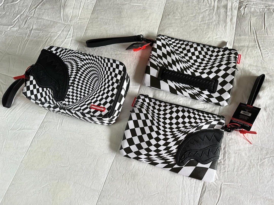 Sprayground Clutch Bag | Christmas Gift Idea (Category: Luxury Bags & Wallets) located in Pasig City. Submitted by tsunami22 (Listing ID 1273503501, Image 3). Description: Last Minute Christmas Present? We Got you! 🎄🎅🏻 Sprayground Clutch Bag All Brandnew With Tags Unisex ₱2,799 only‼️ Pouch with removable wristlet strap, Handle on front panel, Zip Closure, secret stash pocket on side seam 1 interior pocket 7” X 10” X 0.25” Unisex.