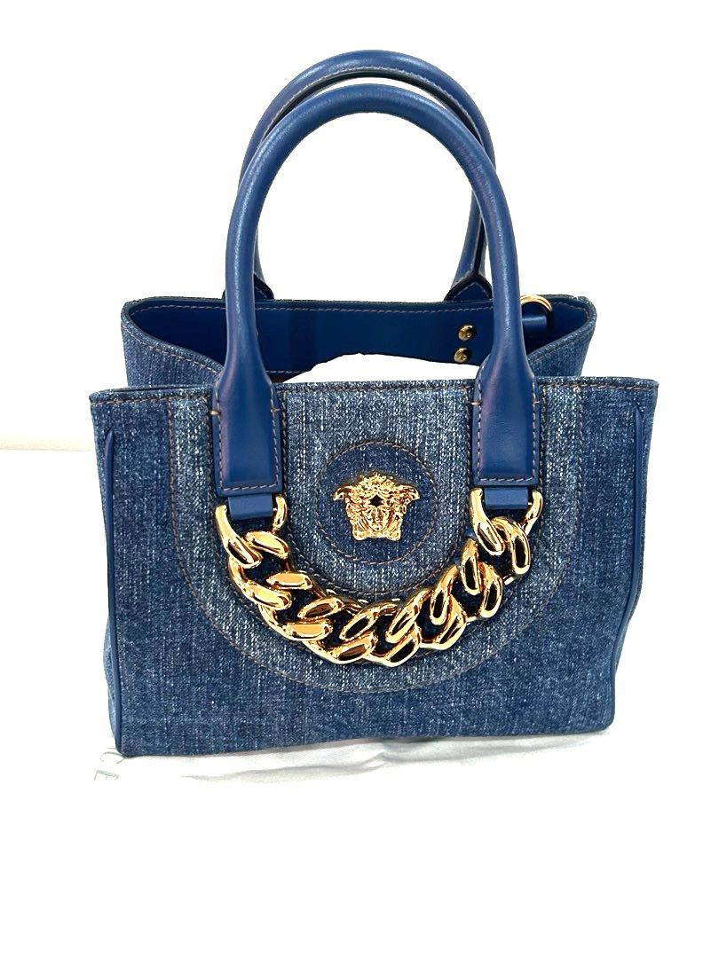 Authentic Versace - La Medusa Small Shopper Bag (Category: Luxury Bags & Wallets) located in Paranaque City. Submitted by cfcisco (Listing ID 1270896297, Image 1). Description: Authentic Versace La Medusa Small Shopper Bag Material Denim Condition: Brand New With shoulder strap With Dust Bag Original Price Tag Authenticity Card No box Last picture is from the internet. Attached for reference only. Original price at the Versace Retail Store is Php