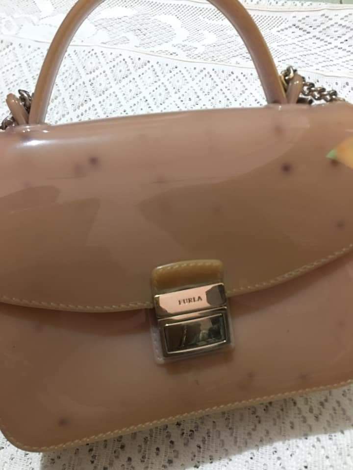 Furla Mini Jelly Bag (Category: Luxury Bags & Wallets) located in Santa Cruz. Submitted by cedrick17 (Listing ID 1273936411, Image 1). Description: sis personal preloved bought 10k selling 1,500 authentic minor issue : -slight fade sa gold hardware -stain sa back po nadikit sa ibang bags -NO DAMAGE AS IS GCASH + SF NO COD.