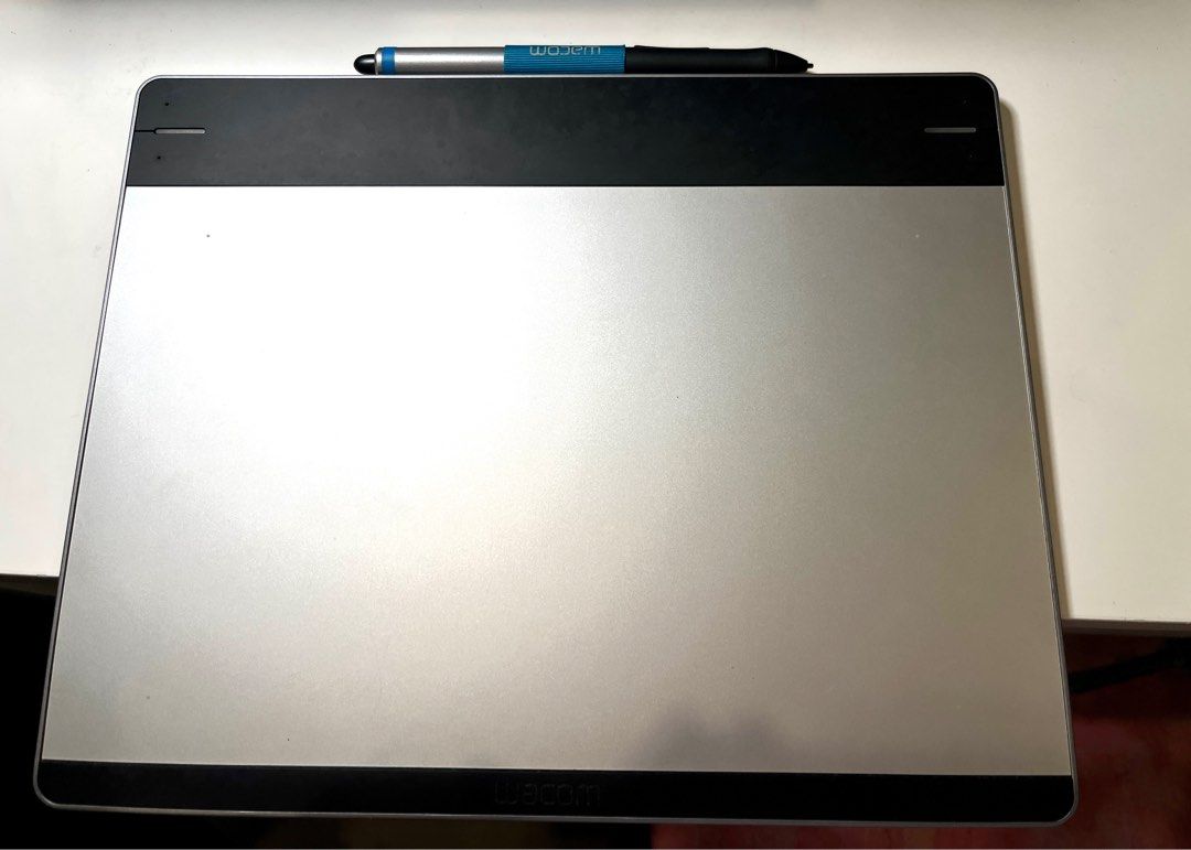 Wacom Intuos Pen & Touch Medium CTH-680 (Category: Other Accessories) located in Quezon City. Submitted by cutelittledragon.365 (Listing ID 1273857668, Image 1). Description: FOR SALE: Wacom Intuos Pen and Touch Medium CTH-680 Digital Art Pen Tablet PRICE: Php 4,000 (Price on Carousell for the same model is around 6K up) SPECS: - Condition: Barely used, Visible scratches, Works perfectly fine - Package includes: Unit, original USB cable, original