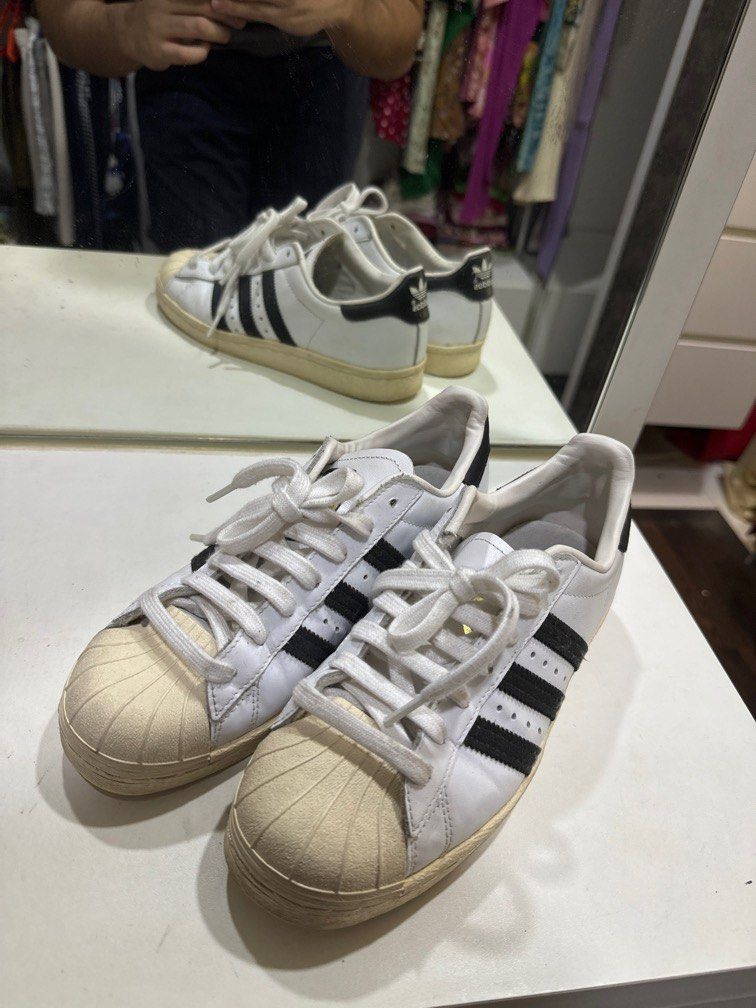 Adidas originals black and gold superstar low top top sneaker