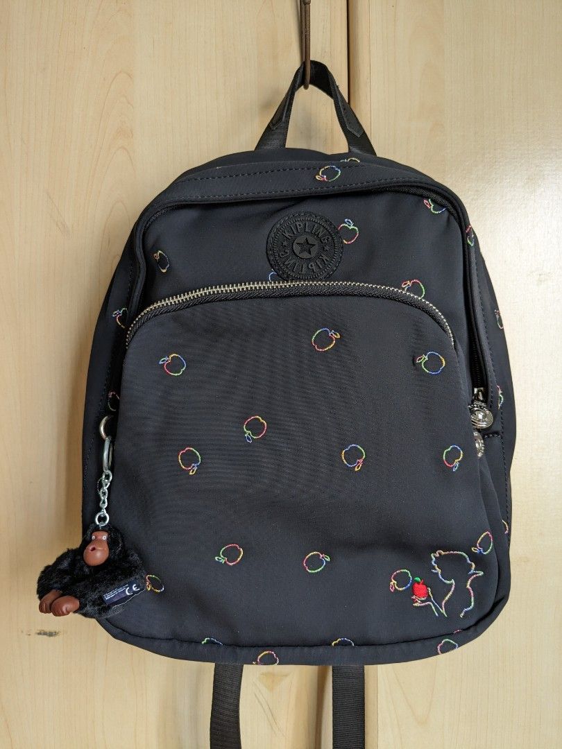 [Kipling] Backpack (Category: Backpacks) located in Singapore. Submitted by dilutedwater (Listing ID 1274166994, Image 1). Description: Kipling Backpack - Disney Snow White Colour: Black/Multi rainbow embroidery Measurements: 21.5cm L x 10.5cm W x 30cm H Handle strap: 2 shoulder straps, 1 handle Design: 1 main zipper compartment, 1 front zipper pocket Interior details: 1 zipper pocket, 2 side pockets, 2 pen slots Condition: 10/10 Meetups: Harbour