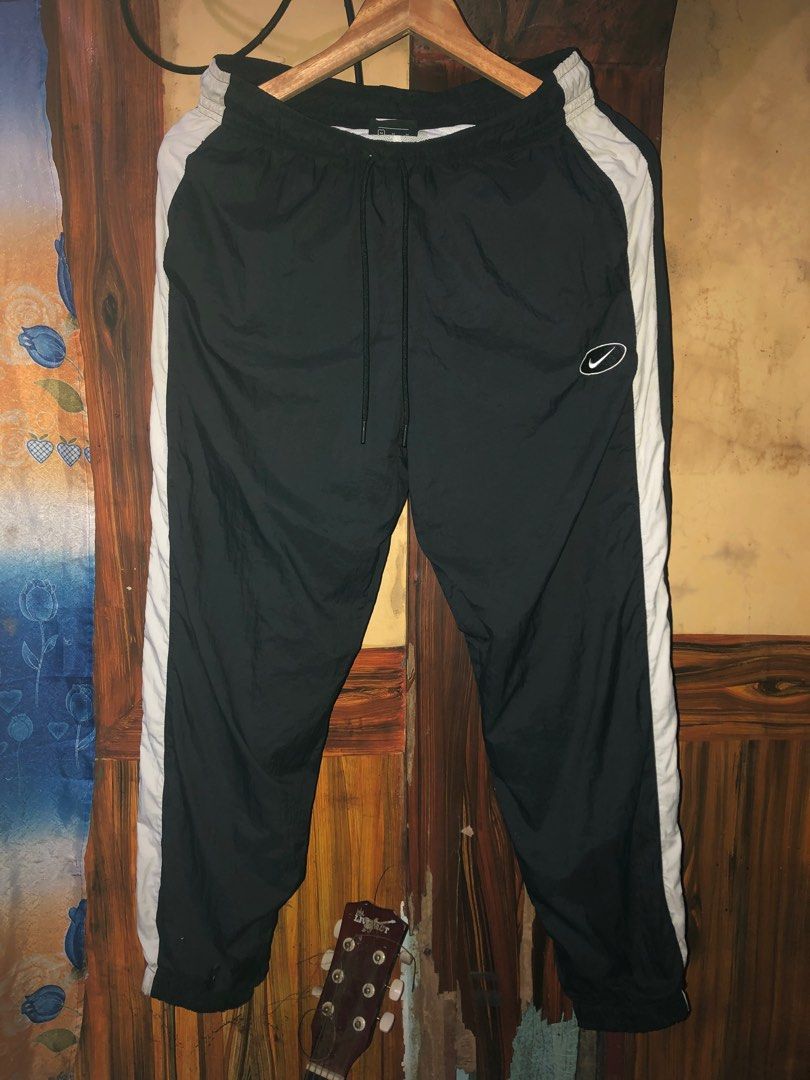 Authentic‼️Nike - Baggy Track Pants, Men's Fashion, Bottoms, Joggers on  Carousell