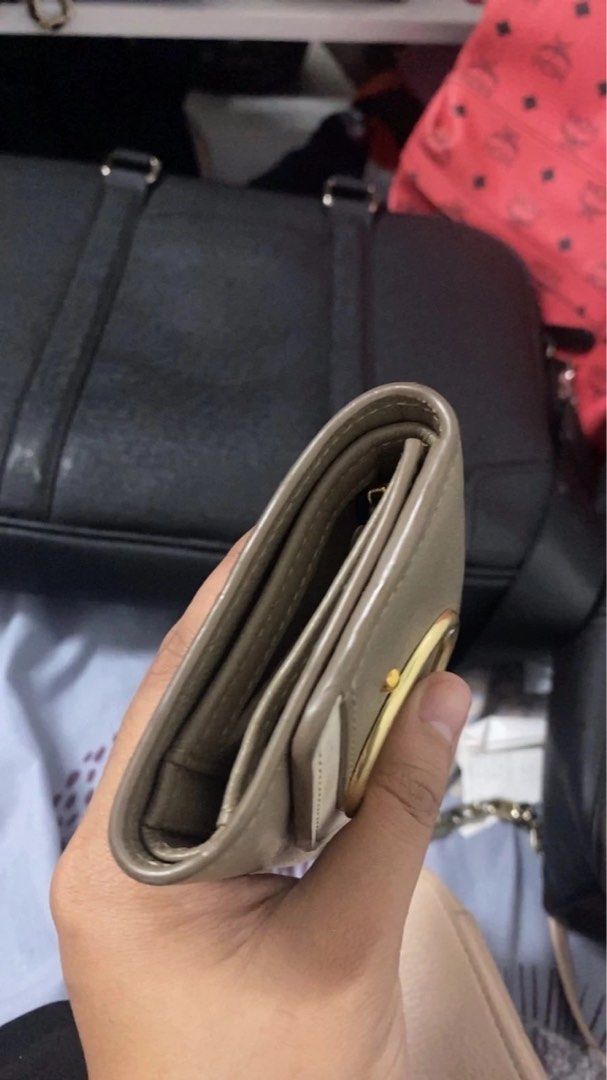 See by Chloe Wallet (Category: Luxury Bags & Wallets) located in Quezon City. Submitted by highhellocurator (Listing ID 1274371482, Image 2). Description: (NEGOTIABLE) This is a see by chloe wallet with qr code and serial code number -color taupe combination of white -gold hardware - with coin compartment and bills - good condition -very genuine leather tatagal ng 100 years.