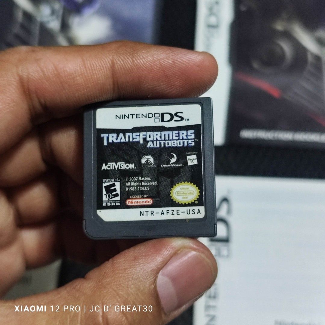 Transformers Autobot DS Game (Category: Nintendo) located in Quezon City. Submitted by shopme_gadget30 (Listing ID 1274297537, Image 2). Description: kindly read the details first for sale fixed price mint condition tested and working with Case and cart with Insert usa region qc area meet up: sm north shipping fee must shoulder by the buyer via lalamove or grab payment: bdo/gcash shoooppppppppeeeeee ⬇️ ⬇️ pm for the link happy gaming everyone.