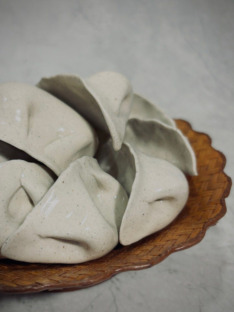 Ceramic Dumpling (Category: Handmade Craft) located in Singapore. Submitted by luclay (Listing ID 1274584471, Image 4). Description: Handmade ceramic dumplings. Fired at 1200 degC. Coated with transparent glaze. Made with light speckled stoneware clay. Hollow inside. Maximum 7 pieces per order. Bamboo plate not included. .