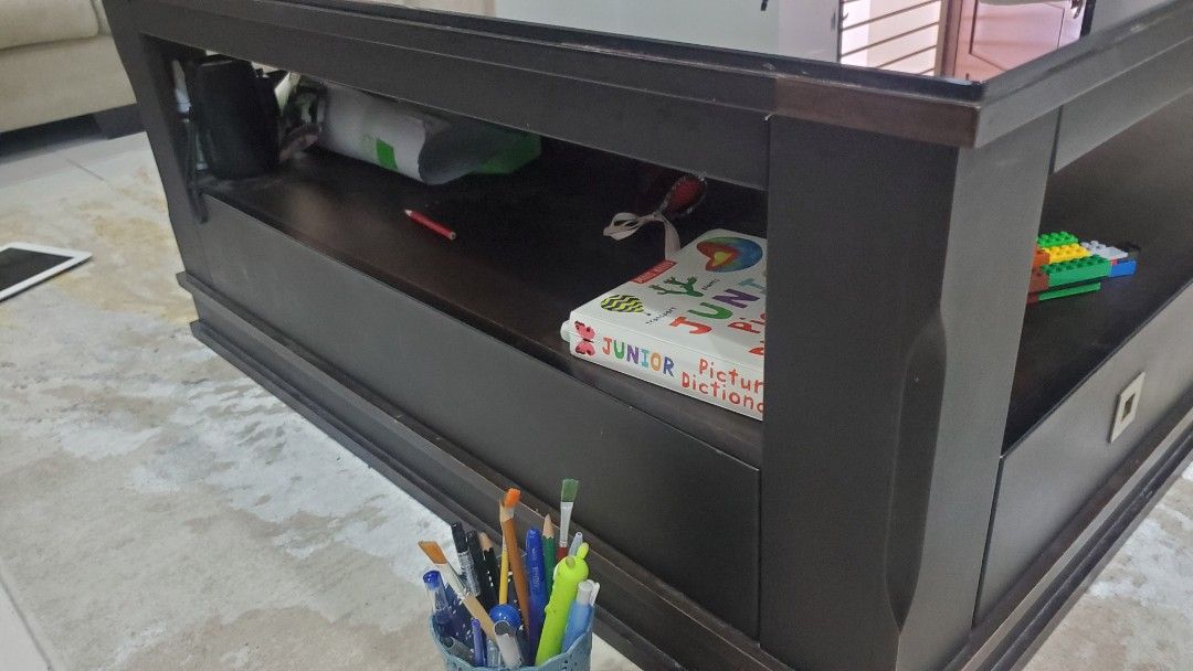 Coffee Table (Category: Tables & Sets) located in Kuala Lumpur. Submitted by abieuwais (Listing ID 1274420105, Image 2). Description: Dark wood coffee table Size 100 x 100cm Top Glass Nice condition.