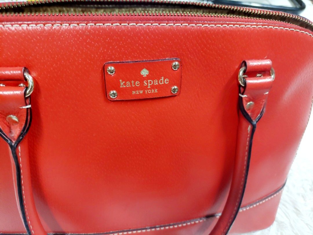 Kate Spade Red Bag (Category: Luxury Bags & Wallets) located in Mandaluyong City. Submitted by kayeson (Listing ID 1274563907, Image 2). Description: Kate Spade Red Bag Rarely used sign of usage but unnoticeable very nice RFS: Not using anymore.
